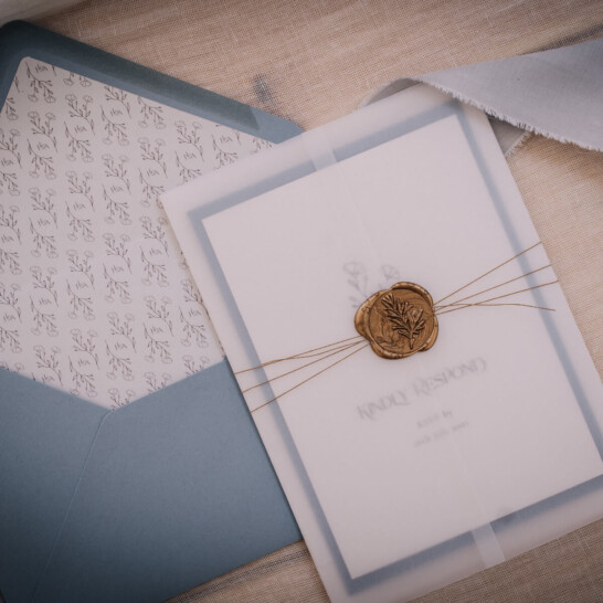 simple elegant wedding invites with heirloom pale french blue envelope, vellum wrap and gold wax seal