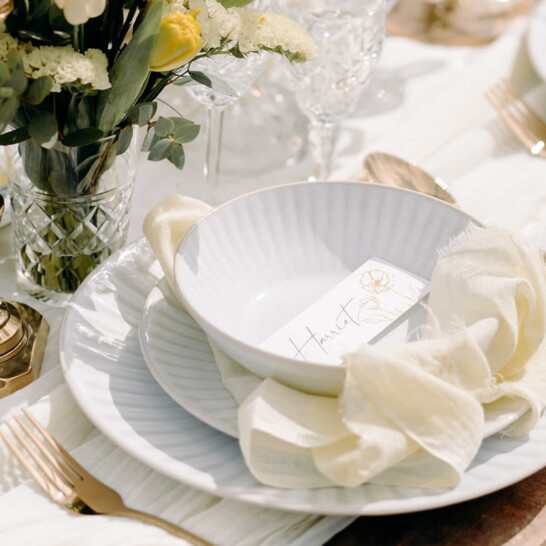 on the day spring wedding lemon yellow place name with poppy illustration at Measham Farm