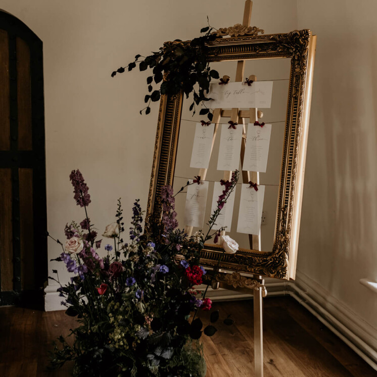 Ellie and Liv on the day table Plan in vintage frame. Bespoke wedding table plan.