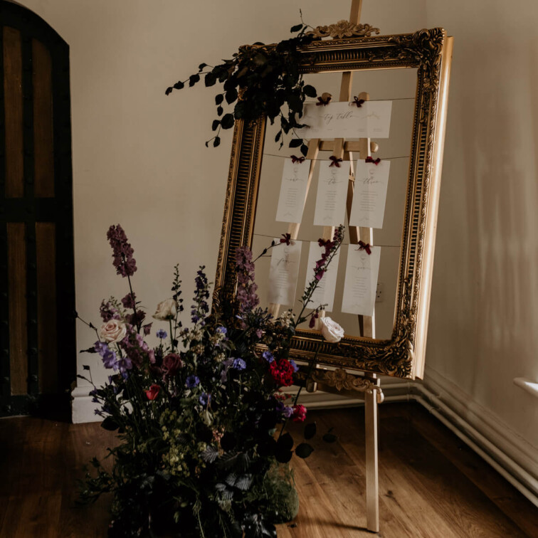 Bespoke on the day wedding table plan. Hung table plan in vintage gold frame.