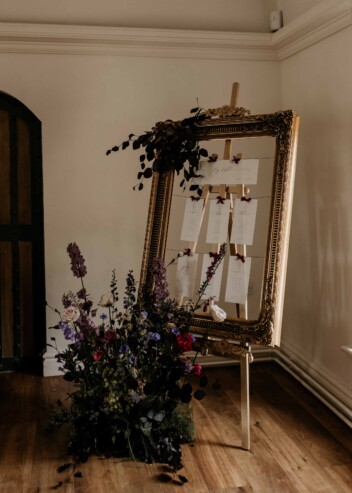 Simple elegant bespoke wedding hanging table plan in vintage gold frame at Newstead Abbey