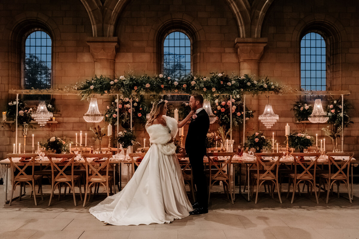 Sneaton Castle Chapel with wedding table. Bride and Groom with winter wedding