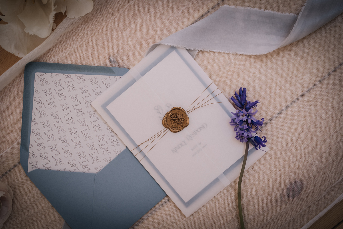 Elegant minimal french pale blue wedding stationery with gold wax seal and white twine