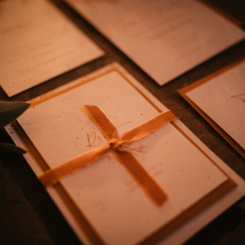 Wildflower and poppy Seeded paper wedding invitation. Plantable wedding invitation in rustic colours for Royle Forest tipi wedding