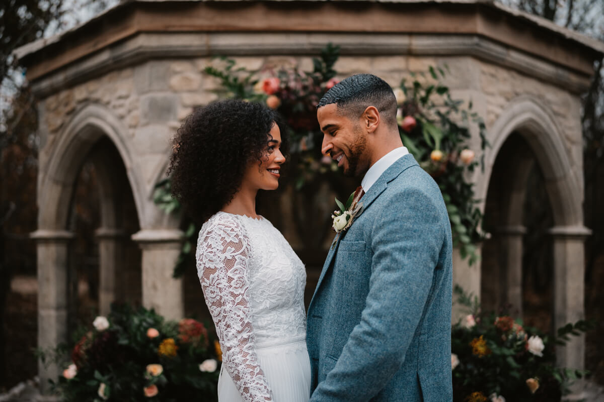 Bride and groom at stone ceremony area at Royal Forest
