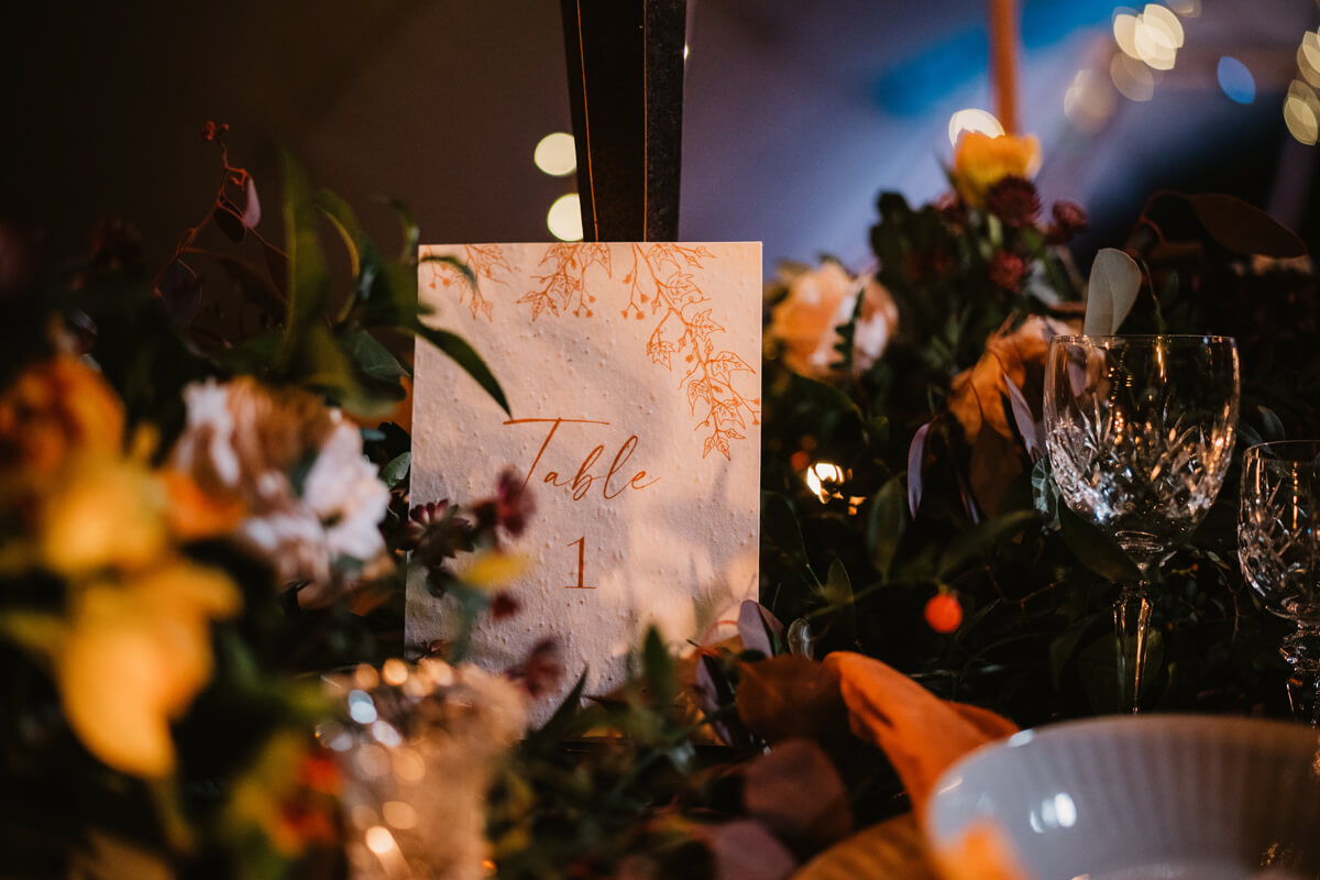 Seeded paper plantable table number at forest wedding on wedding tablescape