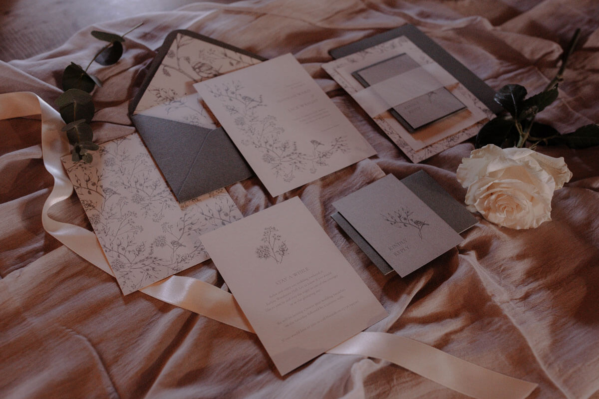 Botanical winter inspired wedding stationery suite with invitation, detail card and rsvp. Green envelopes.