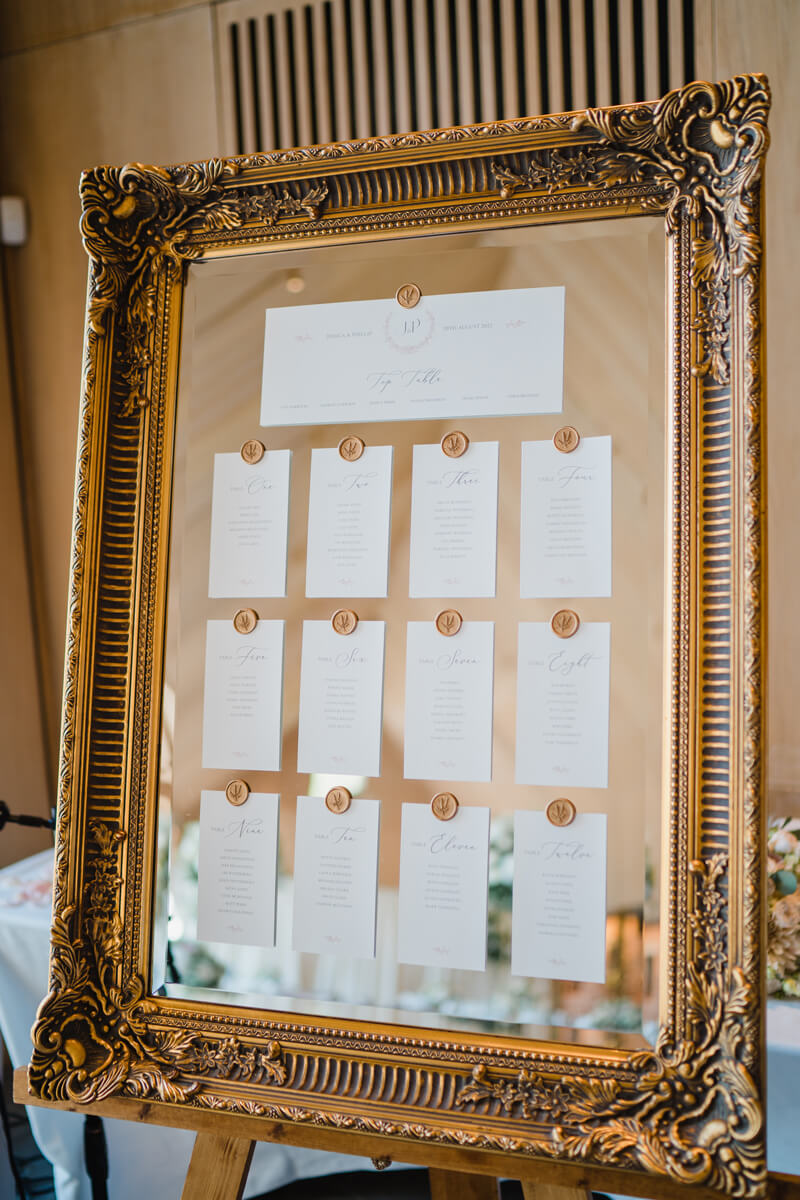 Vintage gold framed mirror wedding table plan
