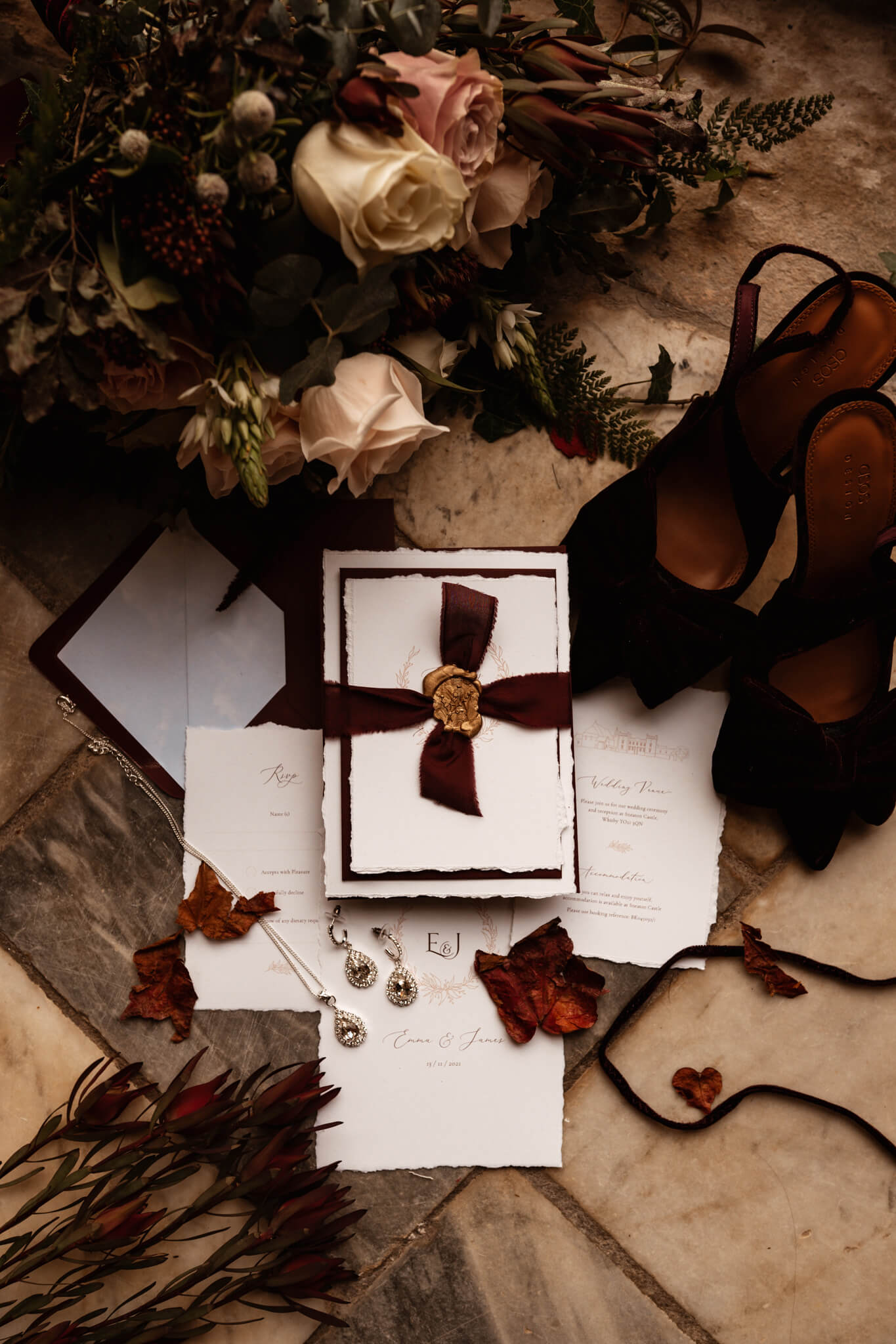 Flat lay of wedding invitation plum wedding invitation