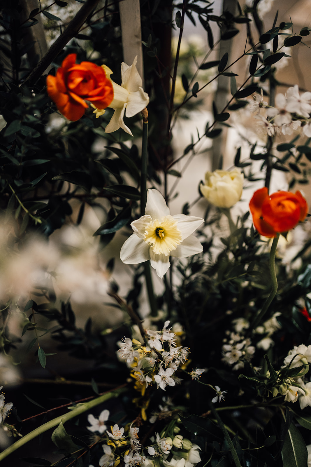 Spring wedding flowers with pale yellow daffodils and Narcissus, orange tulips