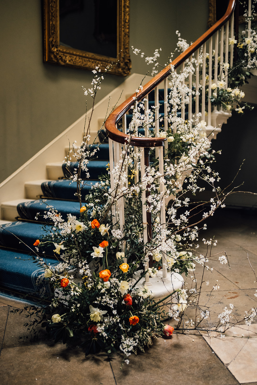Wedding flowers up staircase at Norwood Park Southwell