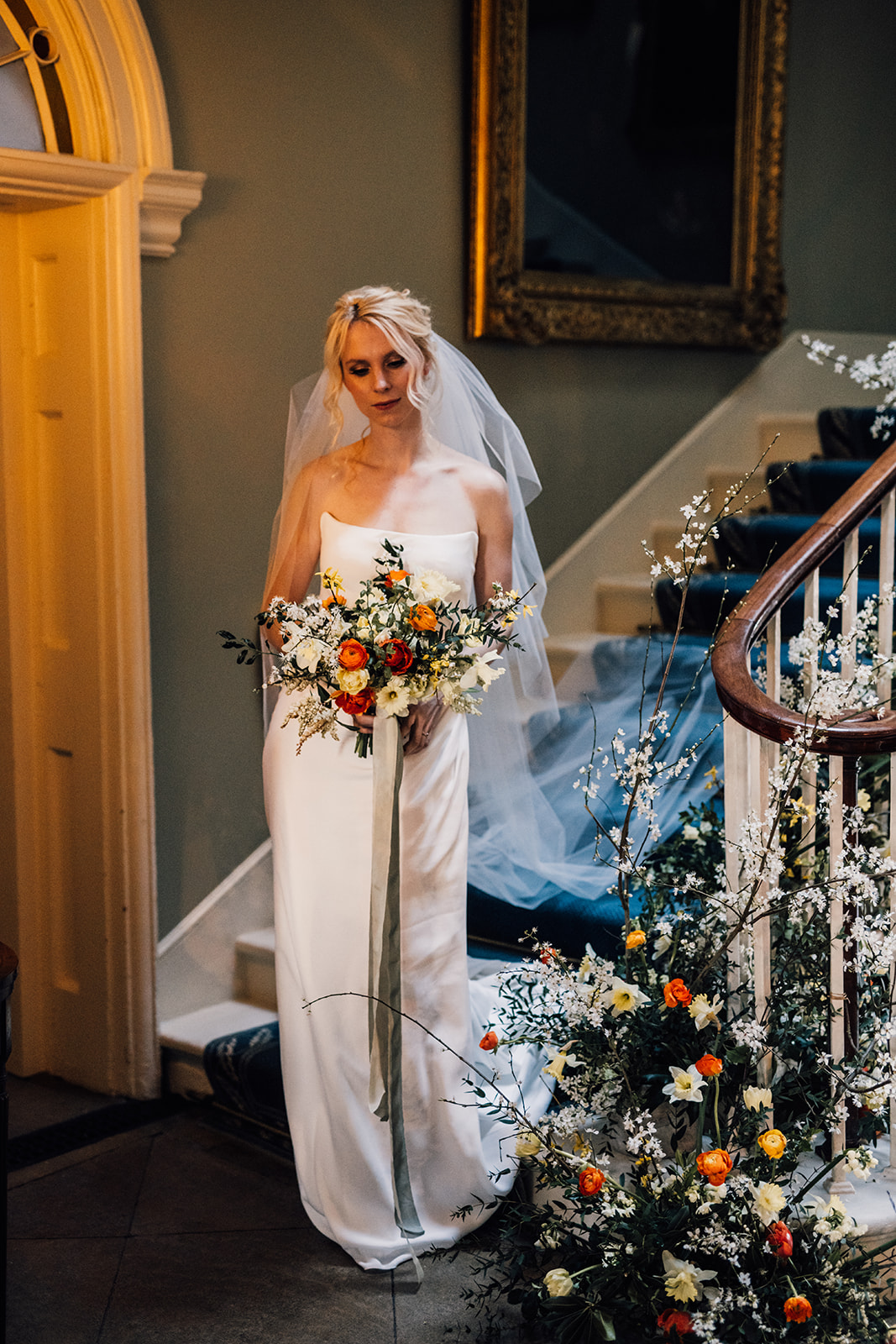Bride stood at staircase at Norwood Park