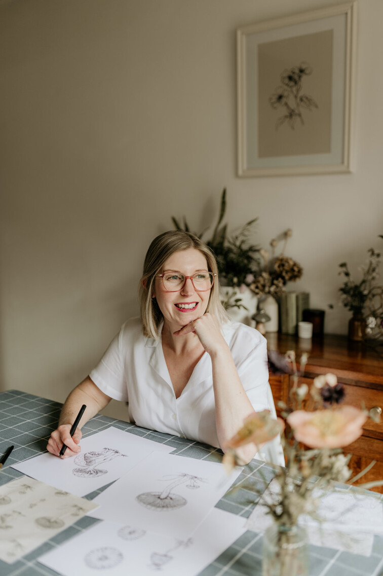 Simone Carr illustrating fine line mushrooms